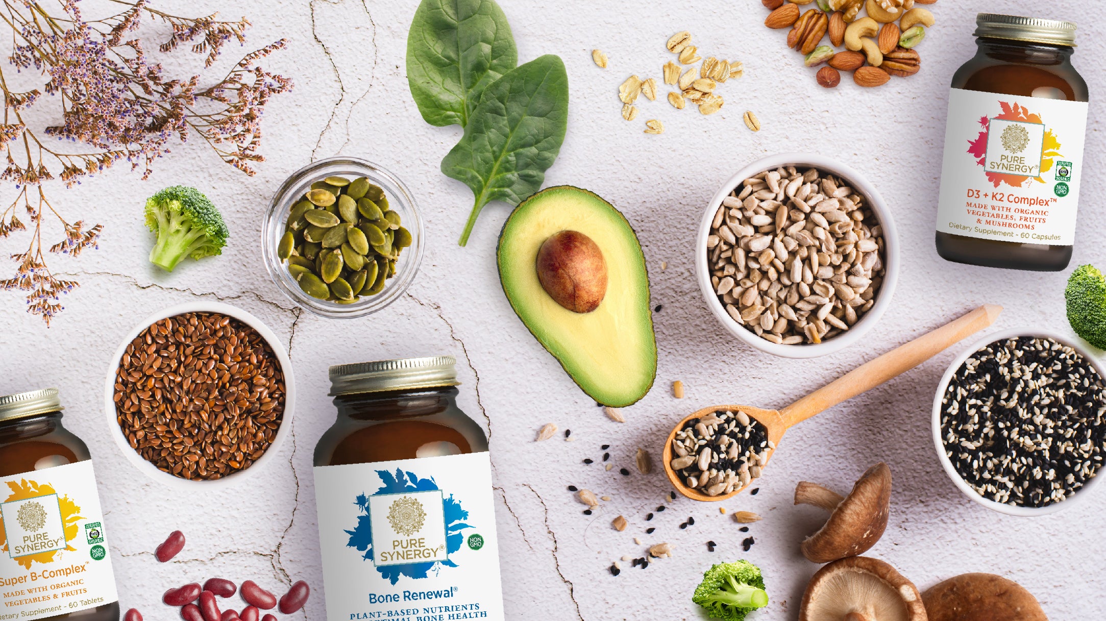 Blog Article Banner: Picture of vegetables, avocado, seeds, beans, and Pure Synergy products (Super B-Complex, Bone Renewal, D3+K2 Complex)