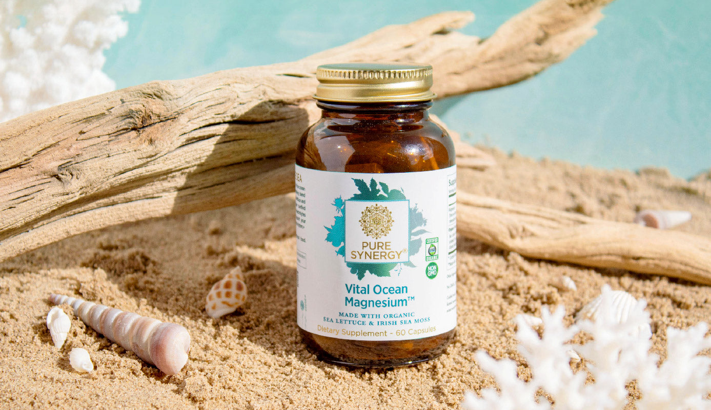 A bottle of Vital Ocean Magnesium on a beach scene