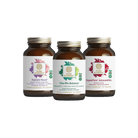 Three brown glass bottles of The Synergy Companys You Glow Girl Bundle are arranged side by side, offering energy and stress support with options including a women’s multivitamin.