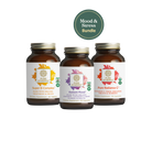 Three bottles of dietary supplements from The Synergy Company are arranged in a row: Mood & Stress Balance, Radiant Mood, and Pure Radiance C. Above them is a circular label that reads "Mood & Stress Bundle," emphasizing their focus on stress resilience with herbal mood formula support.