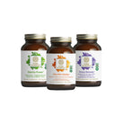 Three brown glass bottles from The Synergy Company’s Working Man Bundle, each with colorful leaf graphics and white labels, stand side by side on a white background.