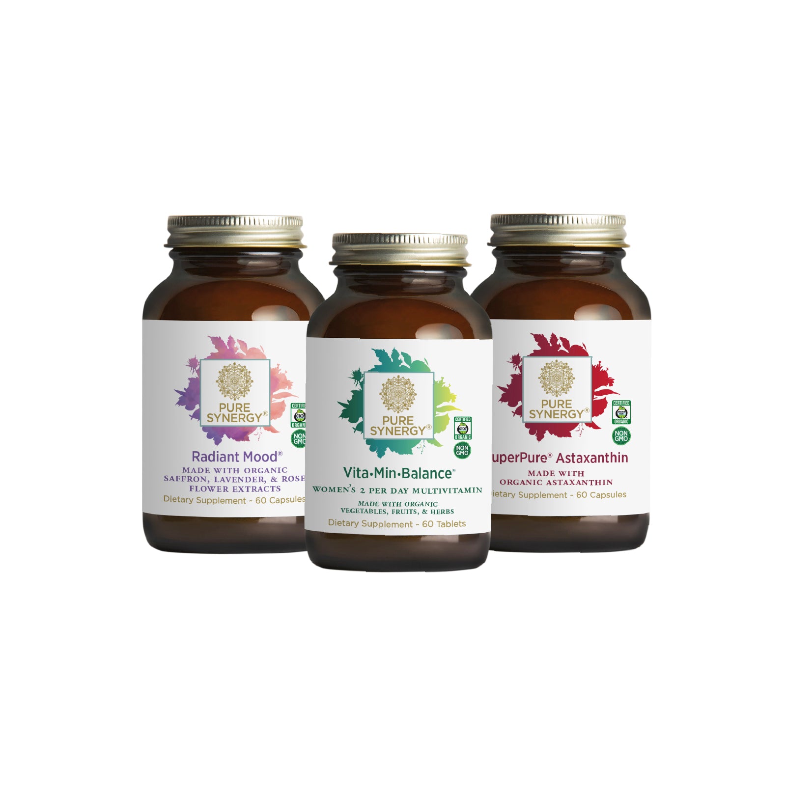 Three brown glass bottles from The Synergy Company’s You Glow Girl Bundle, featuring Radiant Mood, Vita·Min·Balance women’s multivitamin, and SuperPure Astaxanthin with colorful leaf designs on white labels, displayed on a white background.