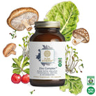A bottle of The Synergy Company Zinc Complex™ capsules is surrounded by illustrated mushrooms, leafy greens, and radishes. It features fermented zinc and organic mushroom mycelia for immune support, with Organic and Non-GMO certification logos on the right.